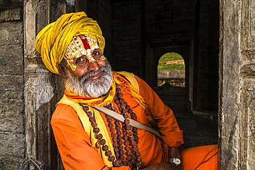 Portait of a Sadhu, holy man, sitting at a shrine at Pashupatinath temple, Kathmandu, Kathmandu District, Nepal, Asia