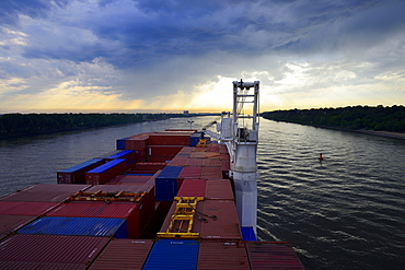 Cargo ship with containers, dusk, Elbe, Hamburg, Germany, Europe