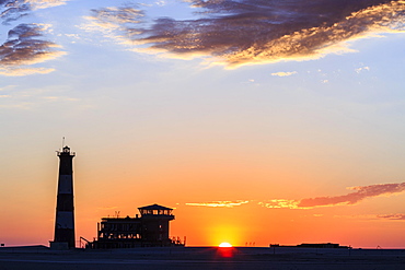 Silhouettes, Lighthouse and Lodge at sunset, Pelican Point, Walvis Bay, Erongo region, Namibia, Africa