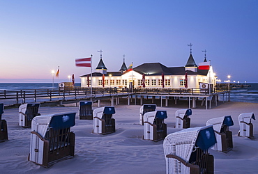 Beach chairs, Ahlbeck seaside resort pier at dusk, Ahlbeck, Heringsdorf, Usedom, Baltic Sea, Mecklenburg-Western Pomerania, Germany, Europe