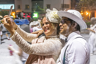 Dressed up couple, white powder and white clothes, carnival La fiesta de Los Indianos, Las Palmas de Gran Canaria, Canary Islands, Spain, Europe