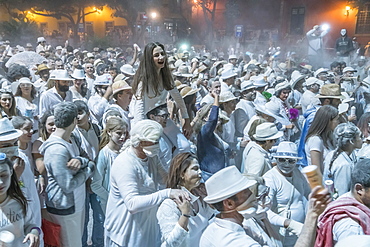 Crowd of people, white powder and white clothes, evening mood, carnival La Fiesta de los Indianos, Las Palmas de Gran Canaria, Canary Islands, Spain, Europe