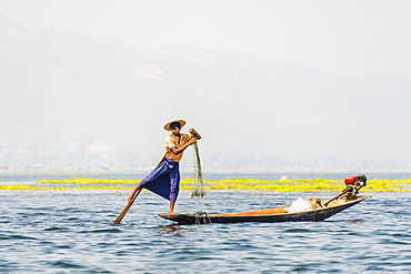 Local fishermen leg rowing on wooden boat, Inle Lake, Shan State, Myanmar, Asia