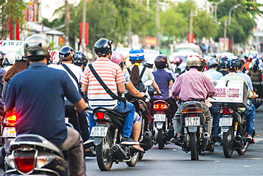 Crowd of scooter drivers in heavy traffic, Ho Chi Minh City, Vietnam, Asia