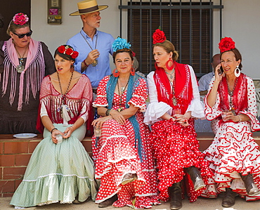 Women wearing colourful gypsy dresses, Pentecost pilgrimage of El Rocio, Huelva province, Andalusia, Spain, Europe