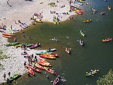 Boats on the beach on the Ardeche river, near Vallon-Pont-d'Arc, Ardeche, Rhone-Alpes, France, Europe