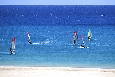 Windsurfers in the turquoise waters off the Playa Risco del Paso beach, Playa de Sotavento, Jandia, Fuerteventura, Canary Islands, Spain, Europe