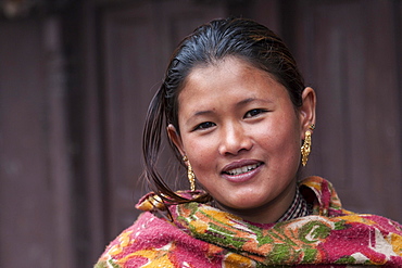 Young Nepali woman with earrings, portrait, Bhaktapur, Nepal, Asia