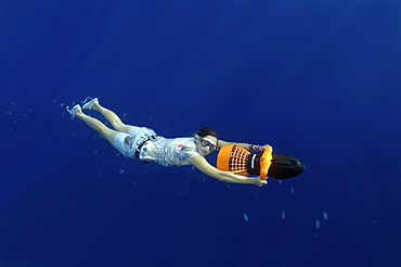 Freediver with an underwater scooter, diving in the Red Sea, Egypt, Africa