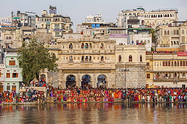 Mewar Festival, a festival women in celebration of Lord Shiva and his wife Parvati at Gangaur Ghat on the banks of Lake Pichola, Udaipur, Rajasthan, India, Asia