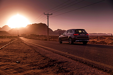 Mercedes Benz GLC250 SUV on the road, Sonenuntergang in Petra, Jordan, Asia