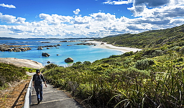 Woman walking down to Greens Pool in William Bay National Park, Western Australia, Australia, Oceania