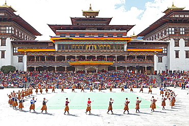 Dancers and spectators at the Tashichho Dzong monastery festival, Thimphu, Bhutan, Asia