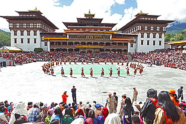 Dancers and spectators at the Tashichho Dzong monastery festival, Thimphu, Bhutan, Asia