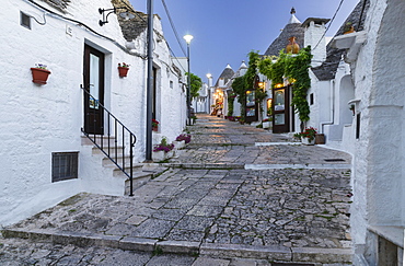 Dusk, shop, trulli traditional round houses, Rione Monti, Alberobello, Valle d'Itria, Trulli Valley, Apulia, Italy, Europe