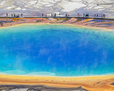 Tourists standing on the edge of Grand Prismatic Spring, Yellowstone National Park, Wyoming, United States, North America