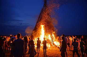 People standing around a Sonnwendfeuer bonfire, Johannifeuer, Upper Bavaria, Bavaria, Germany, Europe