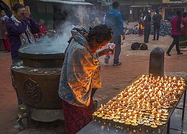 Buddhists in prayer at dawn, Boudhanath, Kathmandu, Nepal, Asia