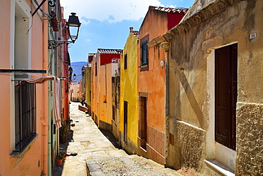 Colourful houses in a narrow alleyway of the historic centre, Bosa, Oristano Province, Sardinia, Italy, Europe
