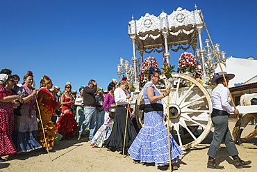 People in traditional clothes and decorated oxcarts, Pentecost pilgrimage of El Rocio, Huelva province, Andalusia, Spain, Europe