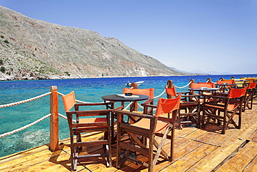 Cafe terrace on the harbour promenade, Loutro, South Crete, Crete, Greece, Europe