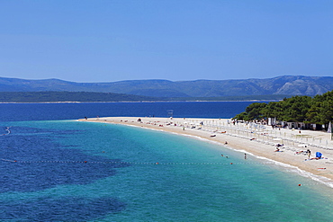 Beach at Zlatni Rat or Golden Horn, island of Hvar at the back, Bol, Island of Brac, Dalmatia, Croatia, Europe