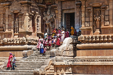 Devout Hindus and children descending a staircase, Brihadeeswarar Temple, Thanjavur, Tamil Nadu, India, Asia