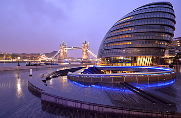 City Hall designed by Sir Norman Foster, Tower Bridge at the back, at dusk, London, England, United Kingdom, Europe