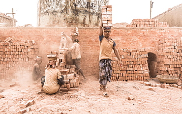 Workers with bricks on their heads in the brickyard, Dhaka, Bangladesh, Asia