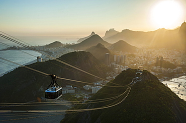 View from the Sugarloaf Mountain or Pao de Acucar and the famous cable car, at sunset, Rio de Janeiro, Brazil, South America