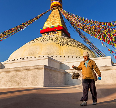 A man walking around Boudhanath stupa, Boudhanath, Kathmandu, Kathmandu District, Bagmati Zone, Nepal, Asia