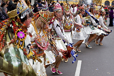 Dancing masks at the Fiesta del Carmen, Lima, Peru, South America