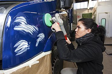 Garage, coachbuilder polishing a vehicle, Dusseldorf, North Rhine-Westphalia, Germany, Europe