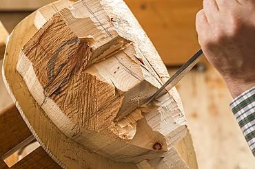 Carving a wooden block, shaping a face, wooden mask carver, Bad Aussee, Styria, Austria, Europe