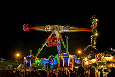 Oktoberfest, Wiesn, amusement rides, giant rotating pendulum at night, Munich, Bavaria, Germany, Europe