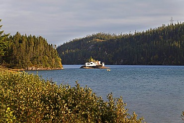 House in a lake, near Riviere Pentecote, Quebec, Canada