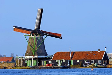 Windmill and house in Zaanse Schans open-air museum, Zaanstad, North Holland, Holland, Netherlands, Europe