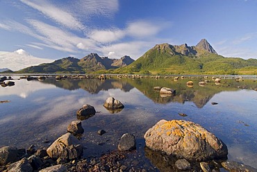 Reflections of the mountains on the island of Langoya, Langoya, part of the VesterÃ‚len, Vesteralen archipelago, Nordland, Norway, Europe