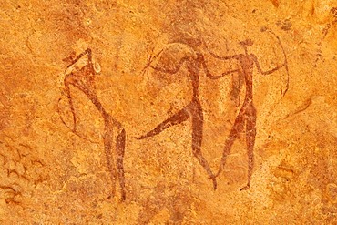 Painted warriors or hunters, neolithic rock art at Tin Meskis, Adrar n'Ahnet, Algeria, Sahara, North Africa