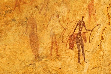 Painted warriors or hunters, neolithic rock art at Tin Meskis, Adrar n'Ahnet, Algeria, Sahara, North Africa