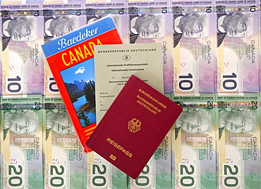 International driving license, passport of the Federal Republic of Germany, guide book for Canada, various Canadian dollar banknotes