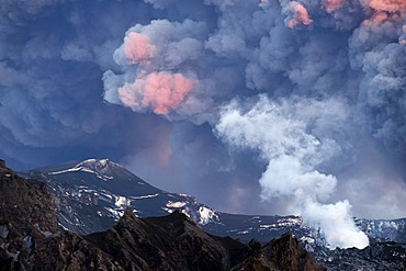 Ash-covered landscape and a vapor cloud under the sun-drenched morning cloud of ash from Eyjafjallajoekull Volcano, Iceland, Europe