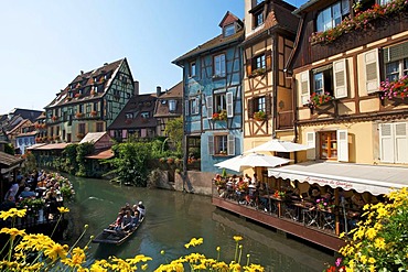 Half-timbered houses and restaurants on a canal in the Quartier des Tanneurs, tanners' quarter, and in Petite Venise, Little Venice, historic centre of Colmar, Alsace, France, Europe