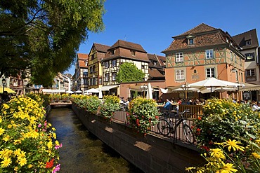 Half-timbered houses and restaurants on a canal in the Quartier des Tanneurs, tanners' quarter, historic centre of Colmar, Alsace, France, Europe