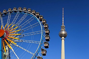 Fernsehturm television tower and Ferris wheel against a blue sky, Berlin, Germany, Europe, PublicGround