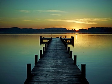 Jetty at Woerthsee Lake at sunrise, Bavaria, Germany, Europe