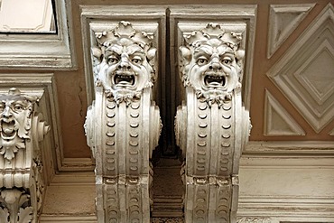 Two grotesques, statues, underneath the balcony of an art nouveau town house, built around 1900, Gruenangergasse street 2, Vienna, Austria, Europe