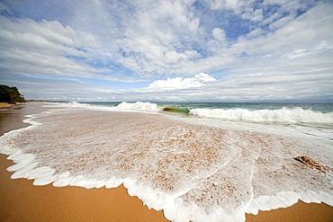 Surf on the sandy beach of Bluff Beach on the island of Colon, Bocas del Toro, Panama, Central America