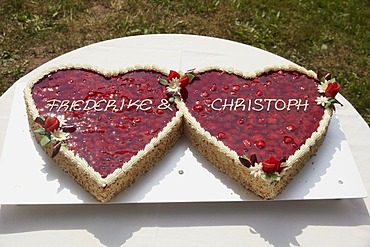 Wedding cake with strawberries in the shape of two hearts