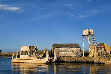 Floating islands of the Urus on Lake Titicaca, constructed by the totora reeds growing there, Puno, Peru, South America